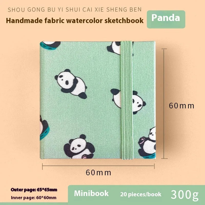 Feiluniao fabric watercolour notebook open showing paper and handmade cover