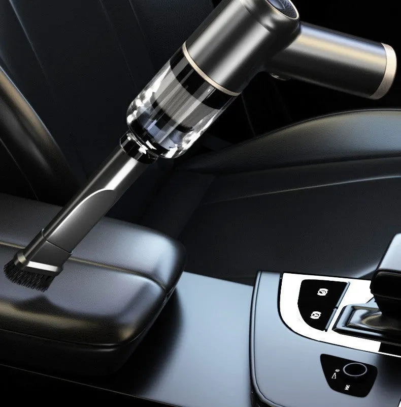 Black wireless handheld vacuum cleaner with attachments for car and home use.