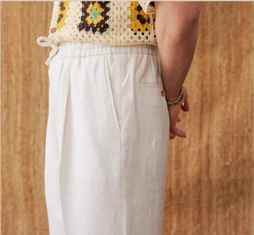 Women's straight-leg linen trousers in high waist design with elasticated back, shown in greige colour.