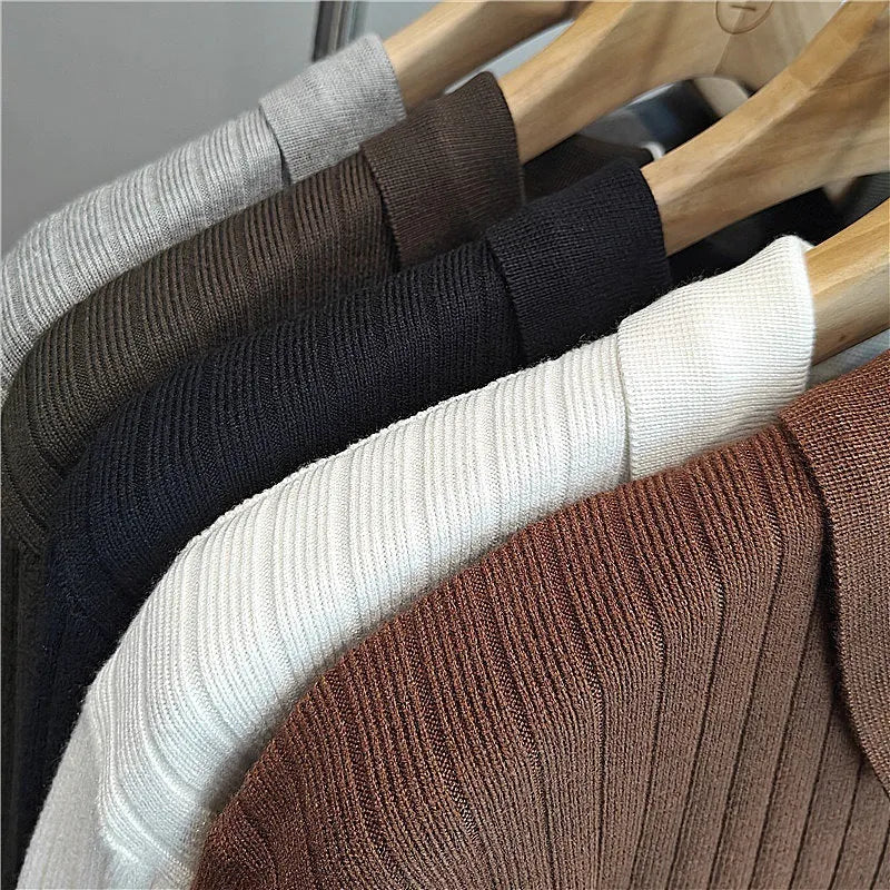 Men's loose grey knitted pullover sweater with a lapel collar on a hanger.