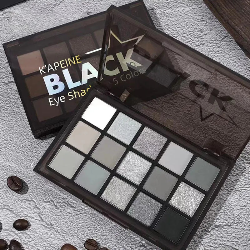 15-colour eye shadow palette with earthy tones and cartoon designs showing shimmer matte finishes