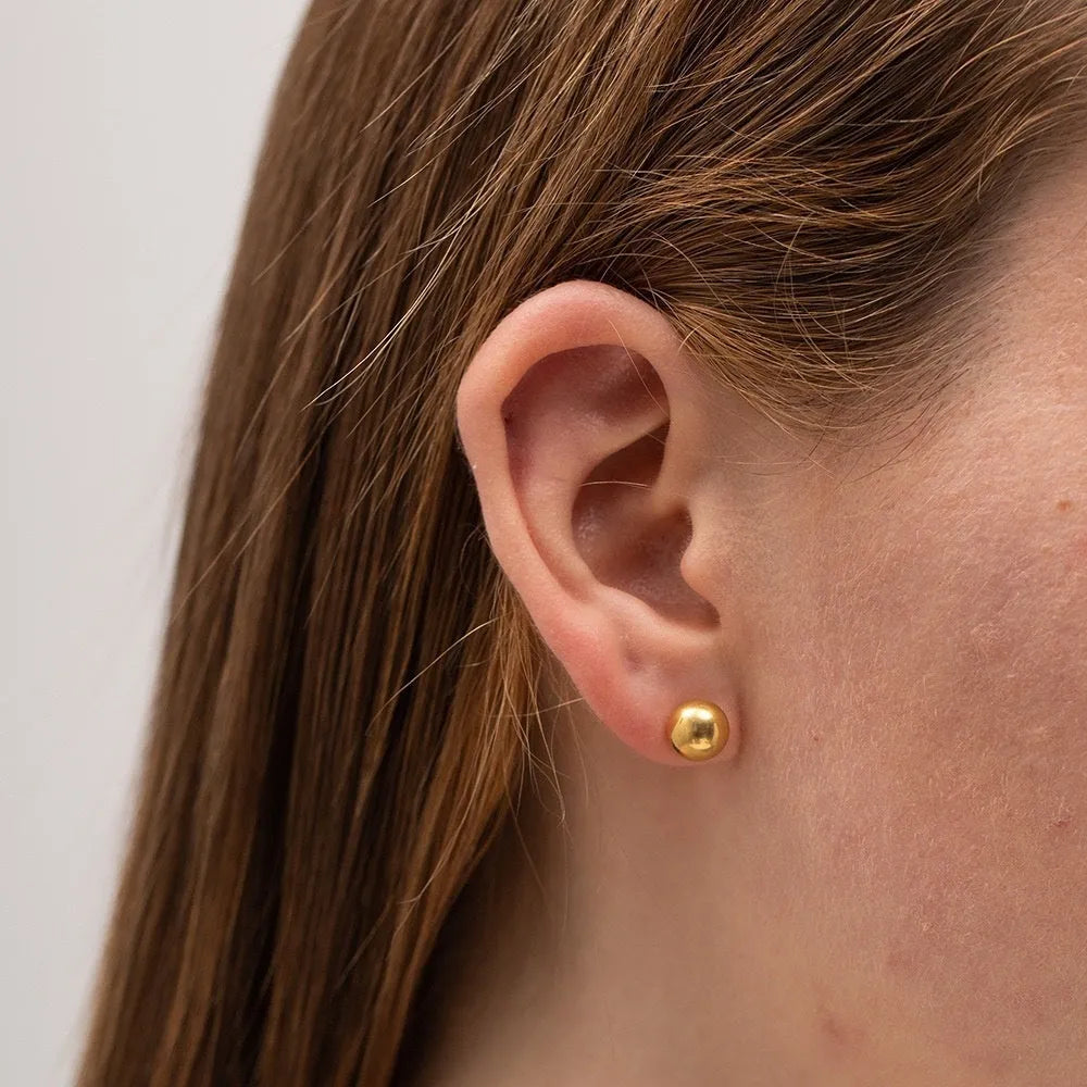Stainless steel ball stud earrings with minimalist geometric design in gold or silver finish