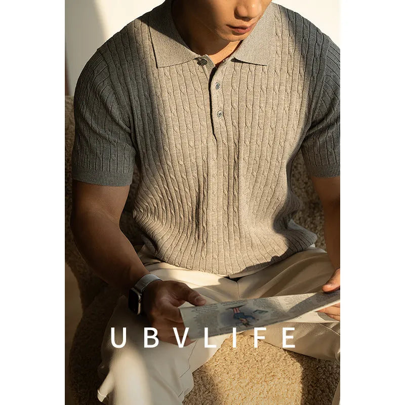 Men's khaki short sleeve business top laid flat, showing collar and button detail.