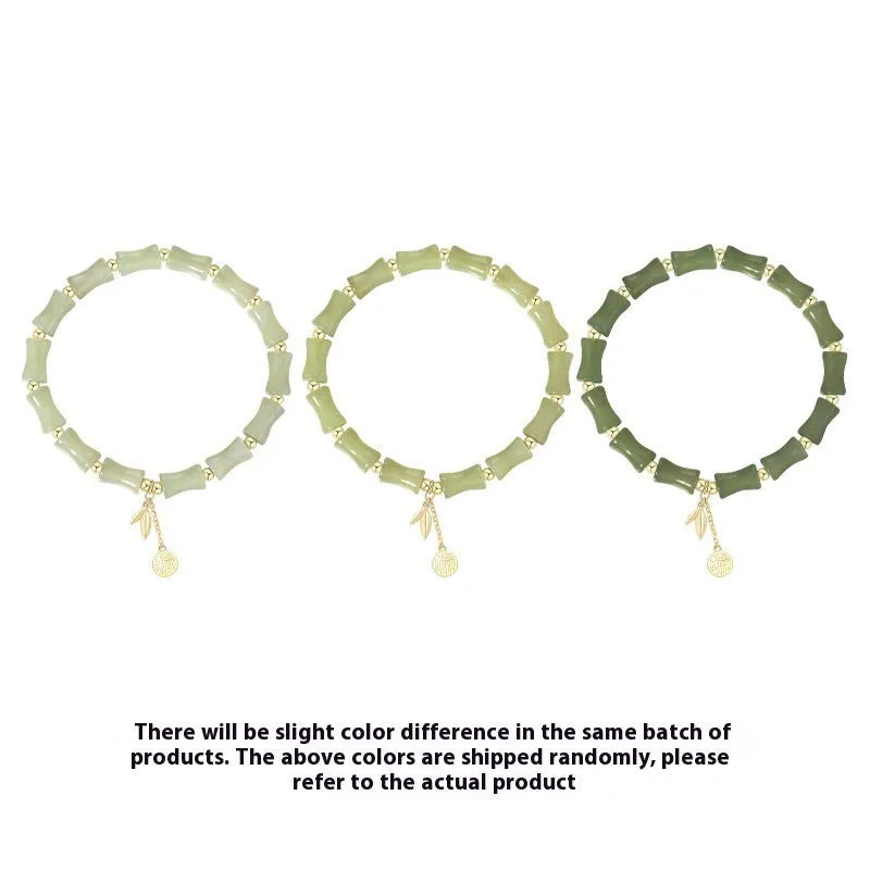 Green Chinese-style bamboo joint bracelet and necklace set made from alloy with Hetian jade accents.