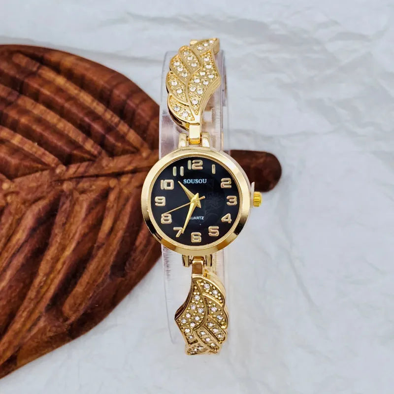 Women's stainless steel watch with gold face round dial and vachette clasp buckle