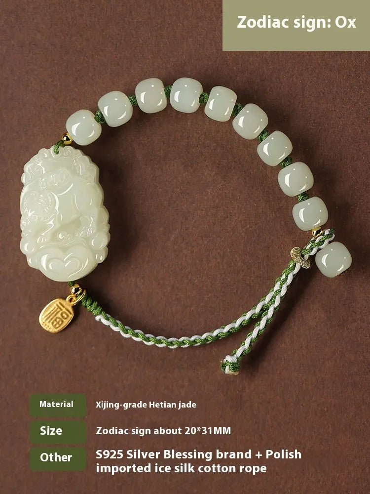Hetian jade rabbit charm bracelet with sterling silver card on a white ice cotton rope.