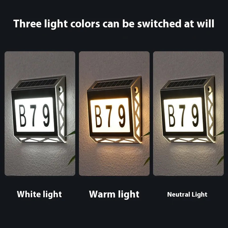 Solar-powered outdoor doorplate light with digital display showing house numbers