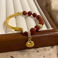 Golden south red agate character ingot women's bracelet with lucky bag design