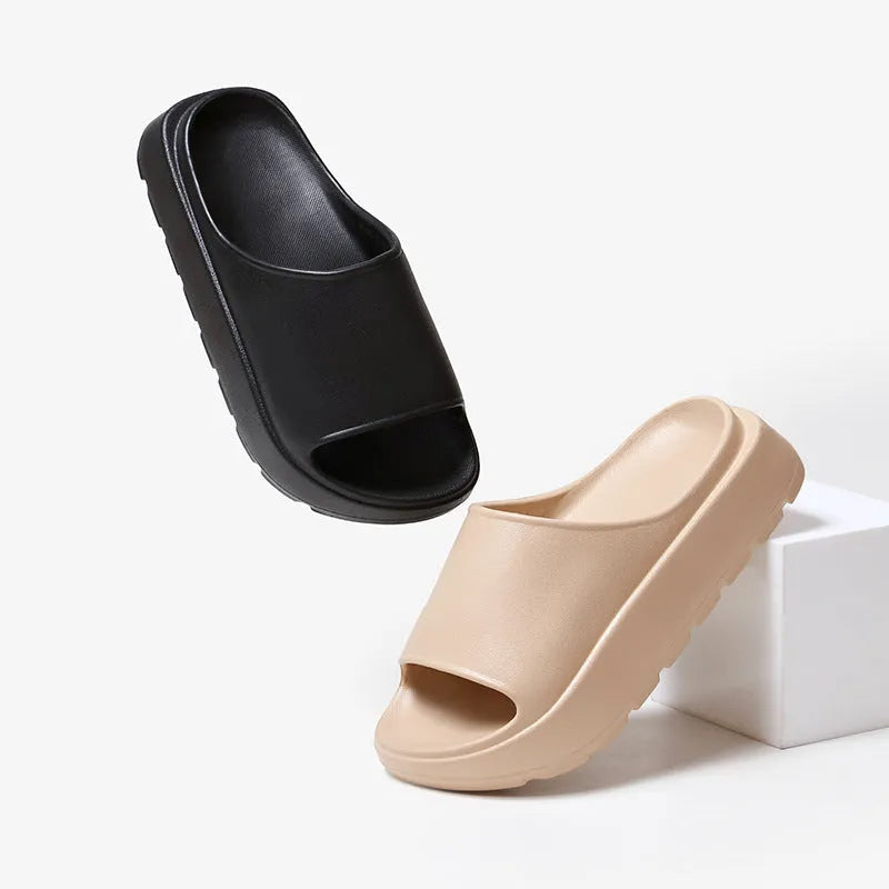 Women's thick-soled beige EVA beach slippers with a fish mouth design.