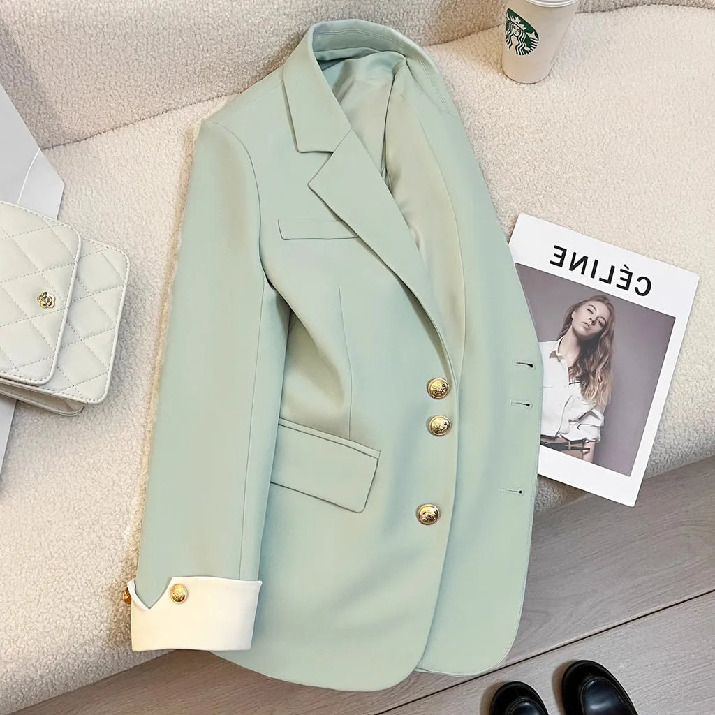 Korean style loose fit women's coat in beige and black with long sleeves and pockets.