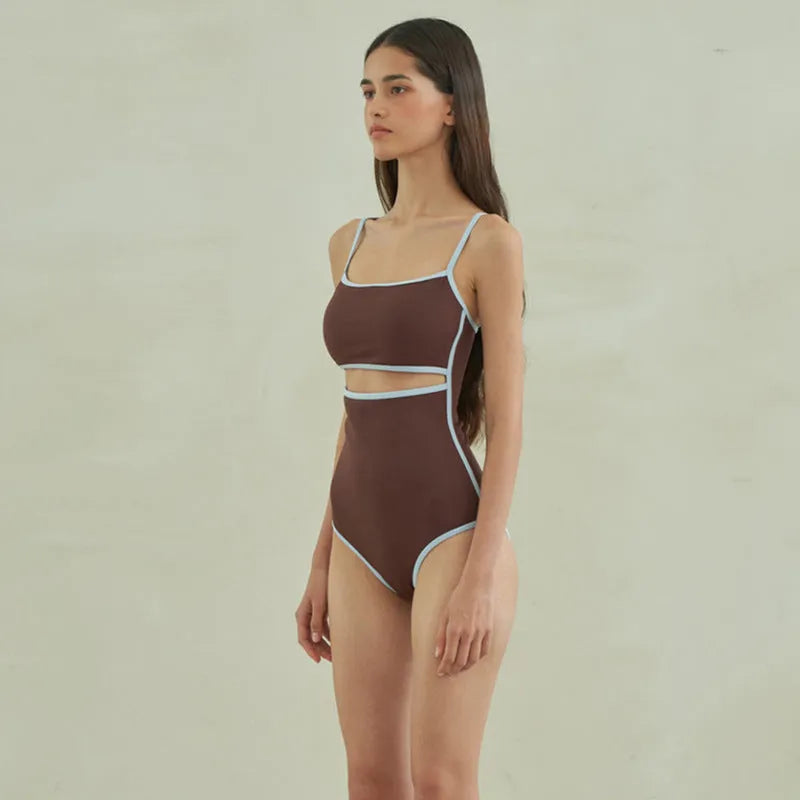 Brown triangle style one-piece swimsuit for women on a hanger