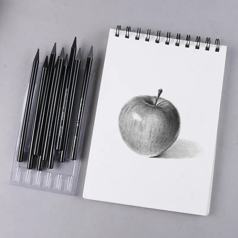Set of six graphite and three carbonised drawing pencils on suction card packaging