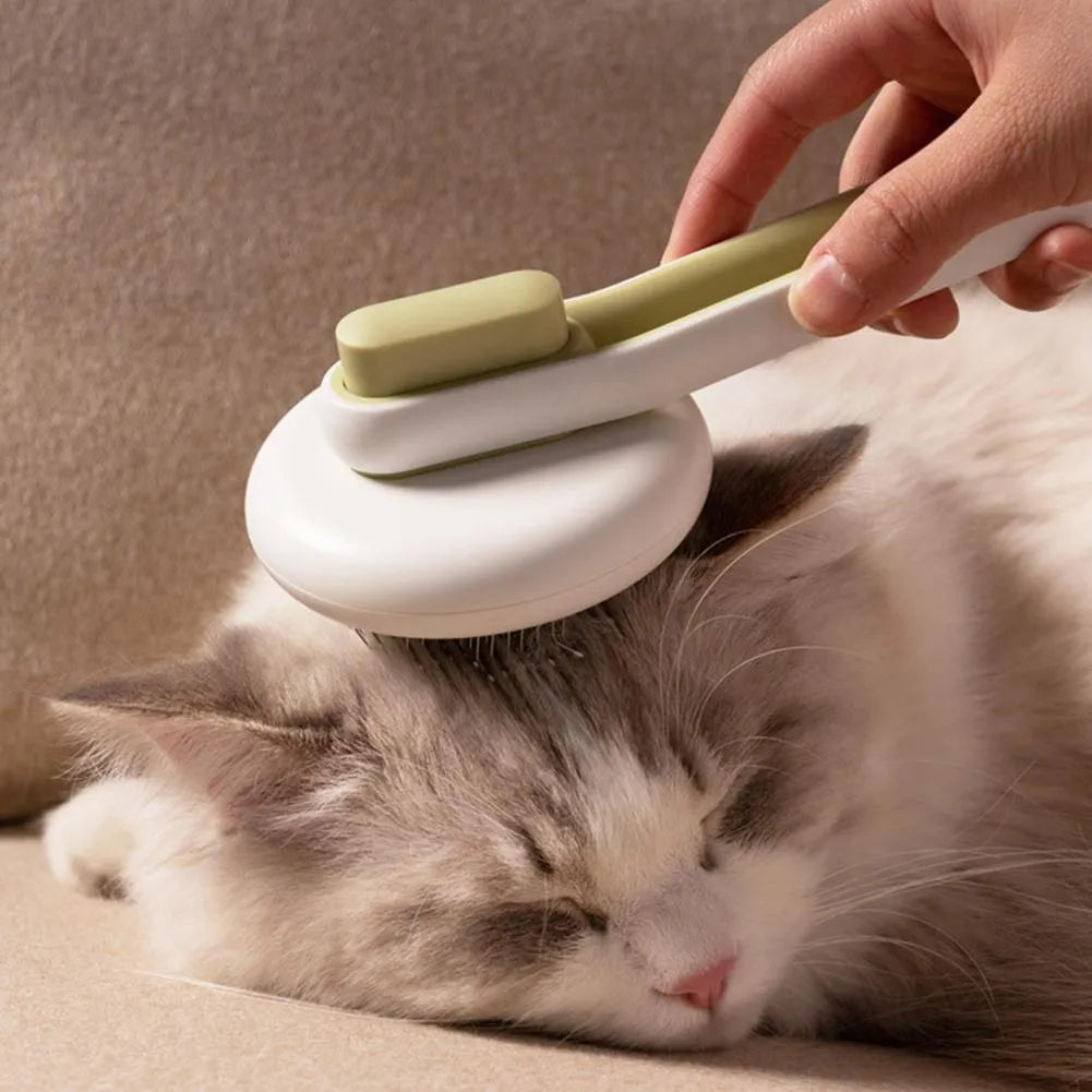 Automatic pet grooming comb with stainless steel teeth, ABS handle, and button release in blue, green, or pink colours