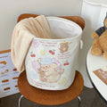 Foldable cotton cloth laundry basket in a choice of colours like puppy print or mint green.