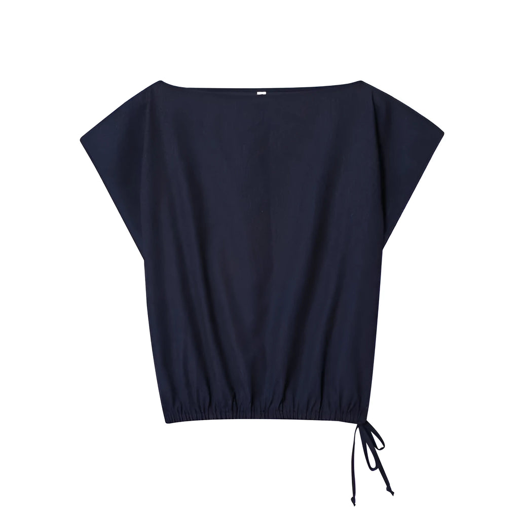 Women's linen blend co-ord set featuring a blouse with flounced sleeves and matching wide leg trousers.