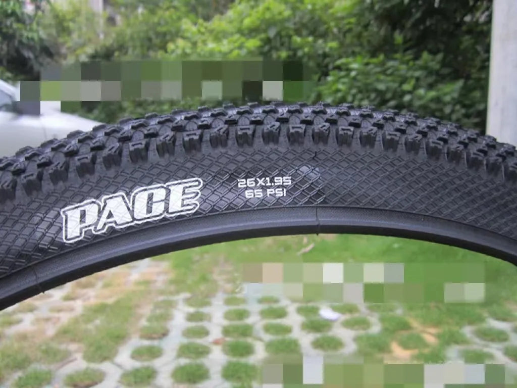 Ultralight puncture-proof mountain bike tyre showing tread and available size options: 26, 27.5, 29 inch.
