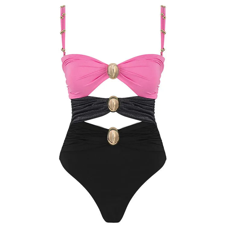 Green women's one-piece swimsuit with round buckle decoration and hollow out stitching on nylon fabric.