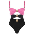 Green women's one-piece swimsuit with round buckle decoration and hollow out stitching on nylon fabric.
