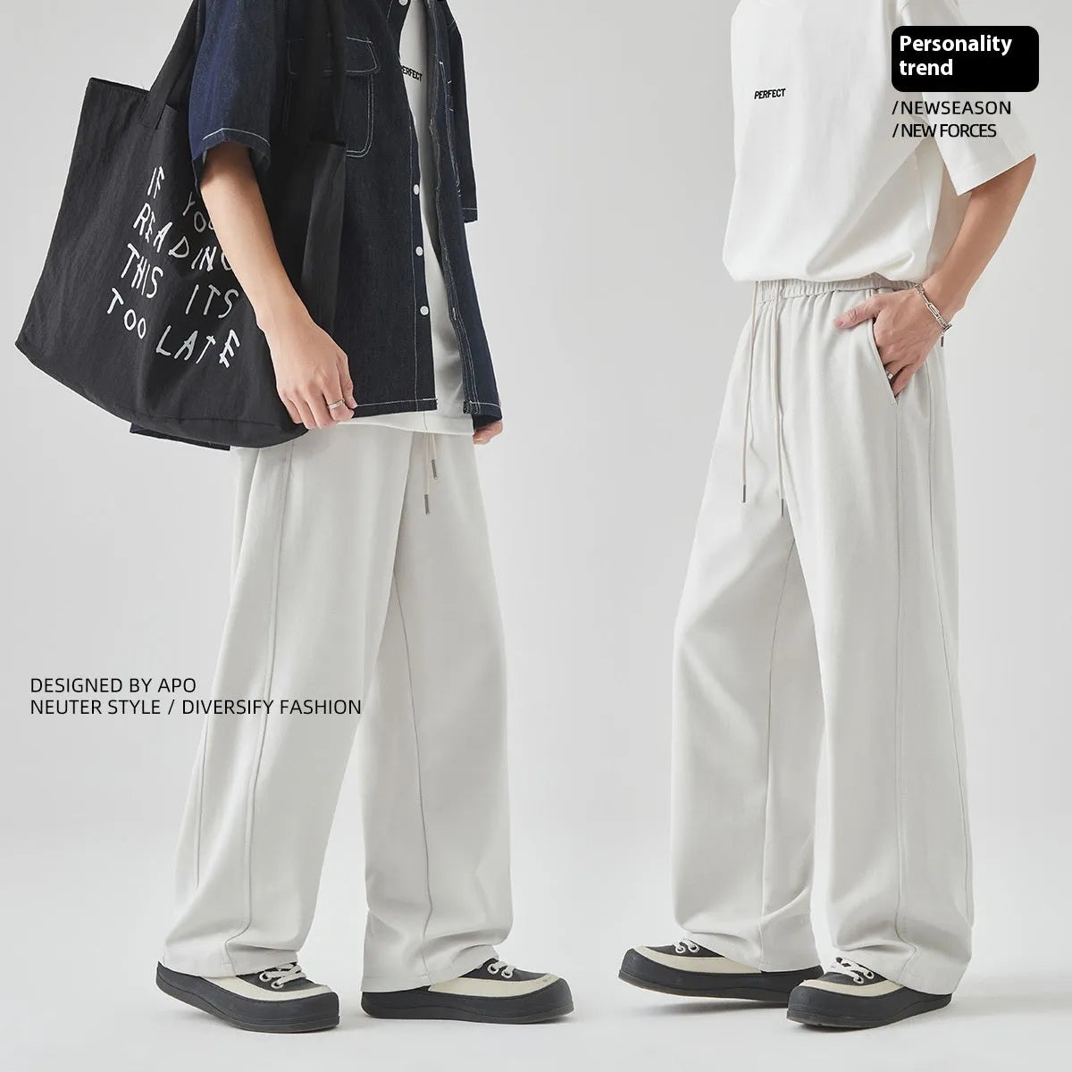 Men's grey high-waisted casual trousers with a lace-up front detail on a plain background.