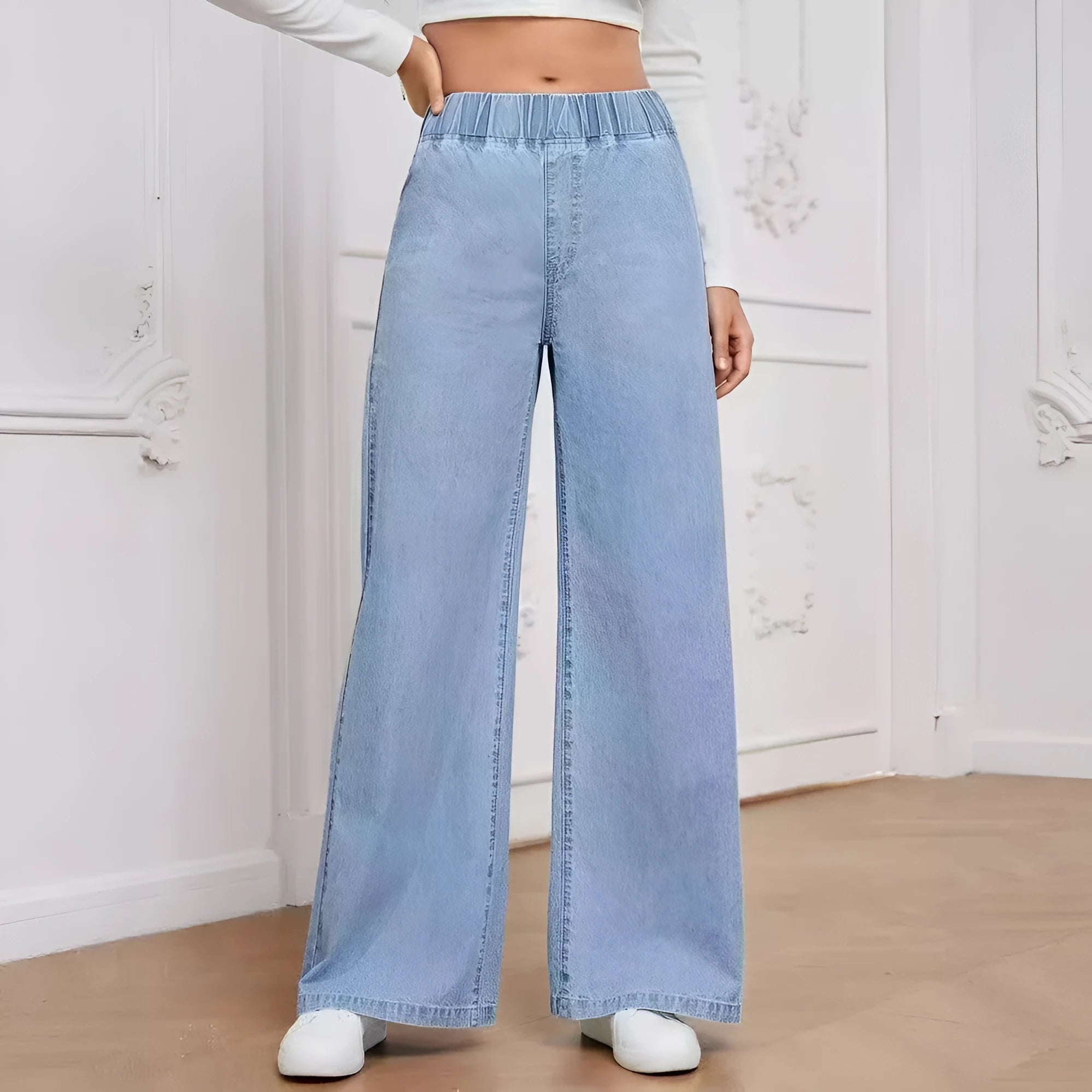 Light blue washed wide-leg jeans with straight cut and zip placket closure