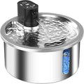 Stainless steel pet water fountain with a white heating base on a wooden floor.
