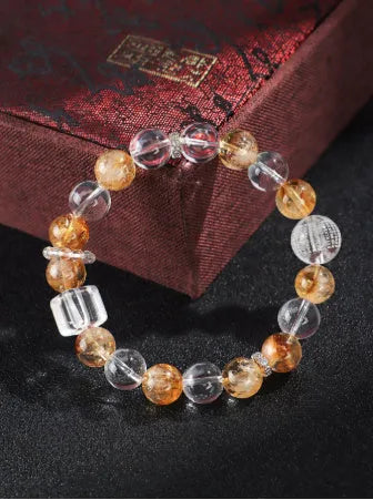 Handmade women's bracelet with white crystal beads, freshwater pearls, and yellow crystal accents
