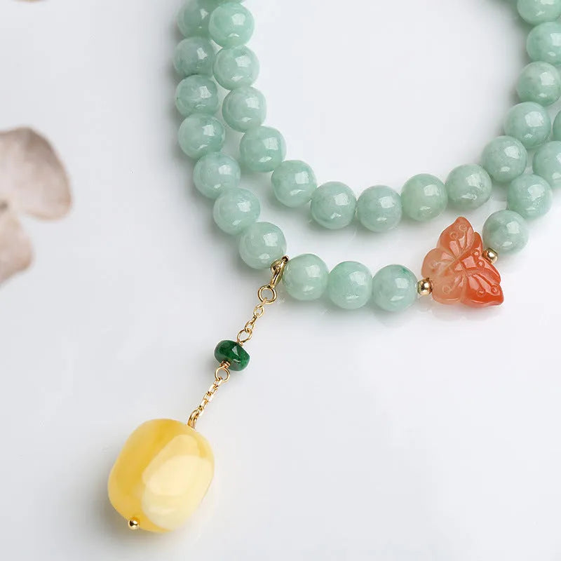 Double-layer women's bracelet with jade round beads and beeswax barrel beads in geometric hanging design