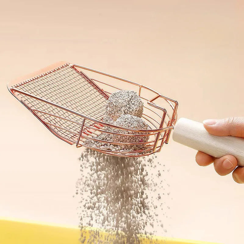 Stainless steel cat litter shovel with wooden handle showing screen filtration area and sharp edges
