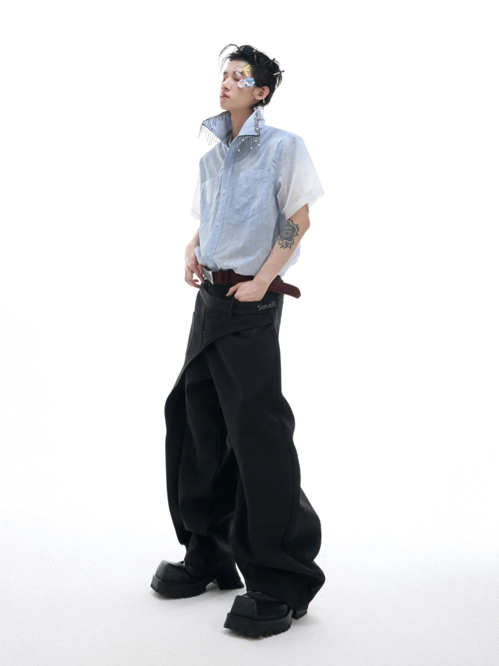Blue and white gradient short-sleeved loose fit shirt on a hanger.
