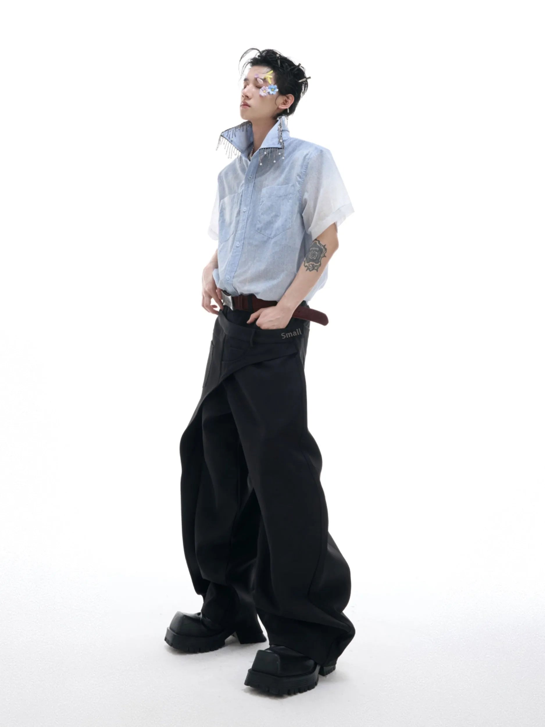 Blue and white gradient short-sleeved loose fit shirt on a hanger.