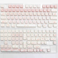 Full set PBT sublimation key caps for mechanical keyboards showing multicolour designs on over 98 keys