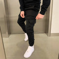 Men's light blue loose-fit casual polyester trousers with patch pockets and an elastic waistband.
