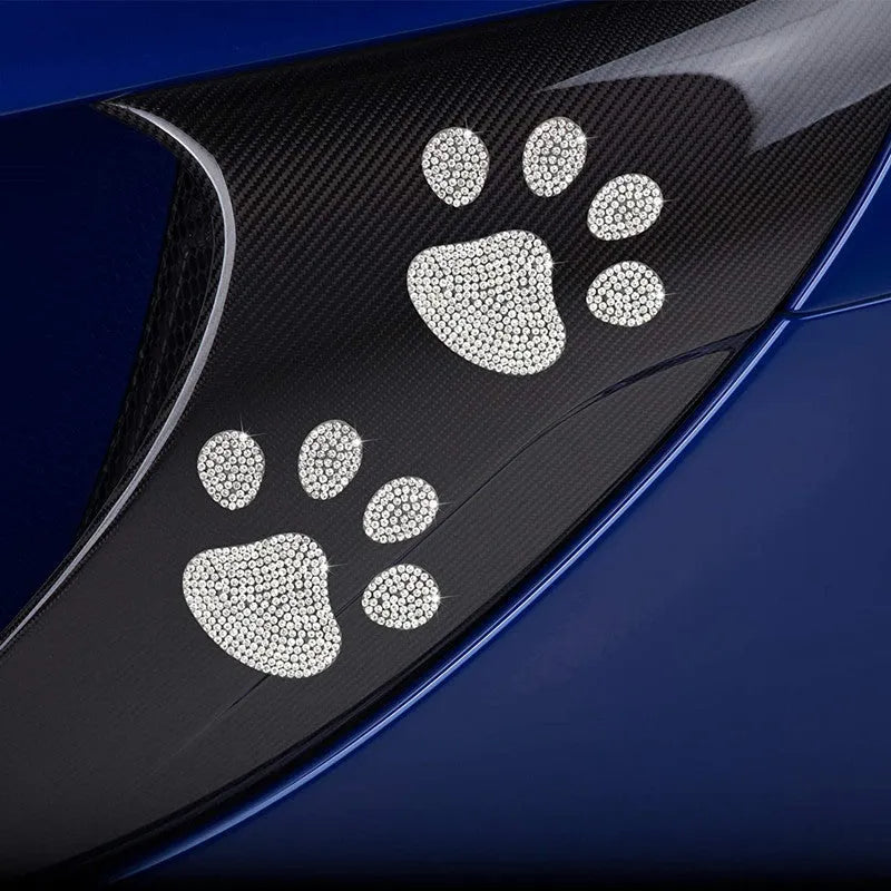 White diamond-encrusted car sticker patch showing butterfly and bear claw designs on a 7x6 cm glass base.