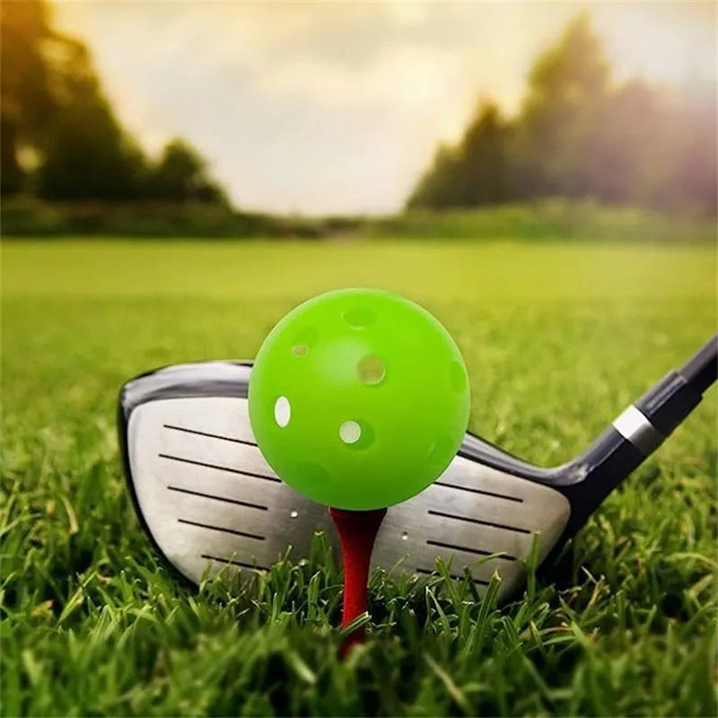 Multi-colour 26-hole golf practice balls in red, orange, blue, green, white, and yellow, displayed in a net bag.
