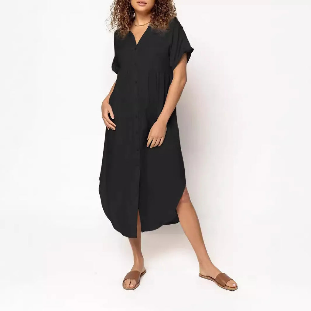 A solid colour mid-length casual dress with a button-down front and regular sleeves on a hanger.