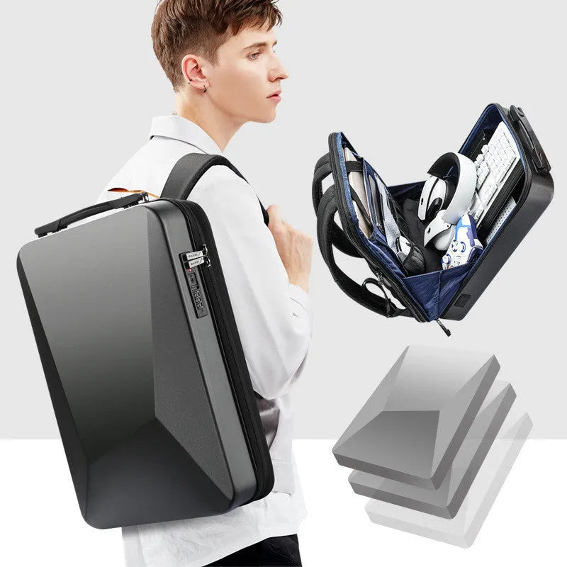 Hard-shell titanium silver gaming backpack with lock, showing internal organiser pockets.