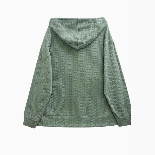 Green women's hooded zipper sweater coat on a hanger, showing loose casual fit.