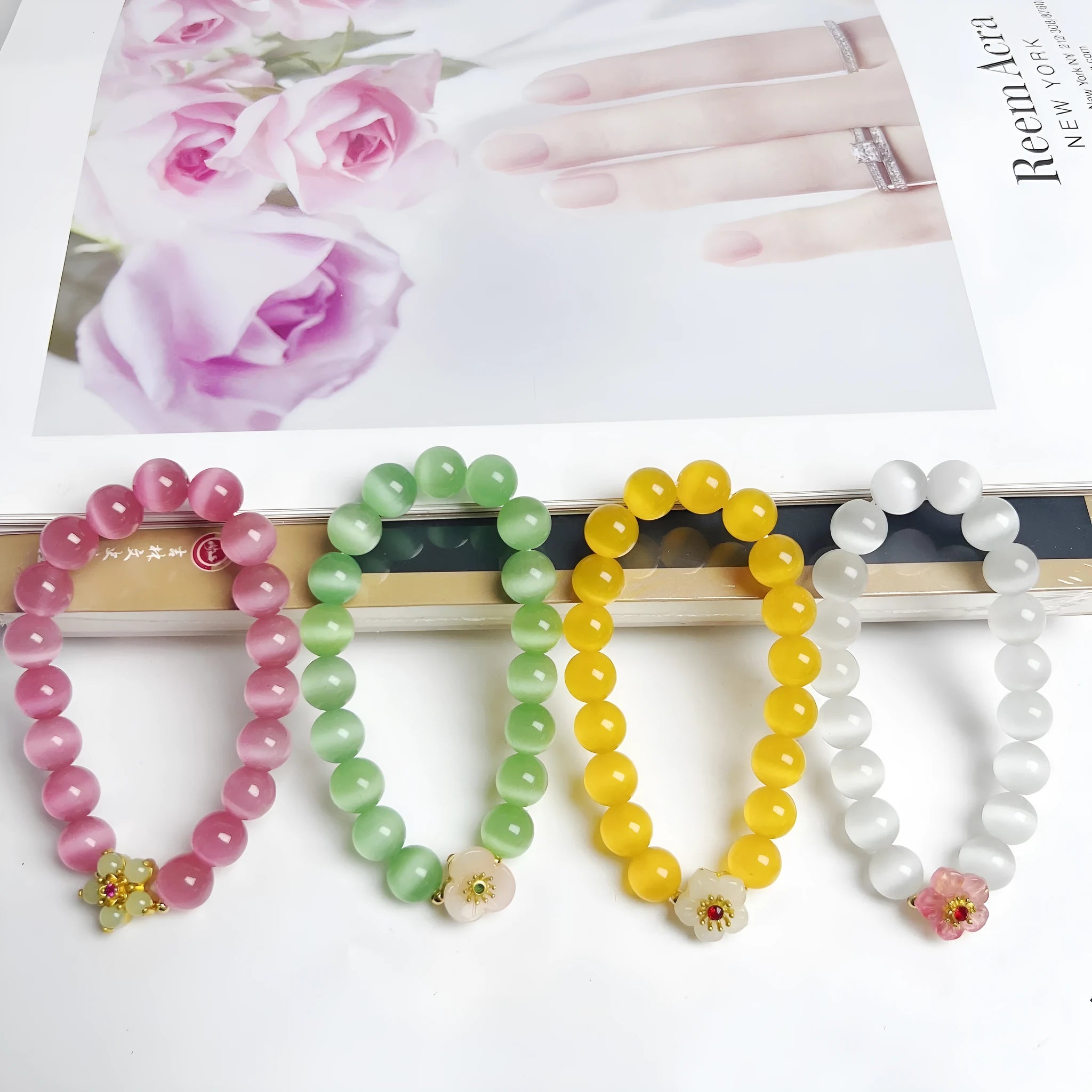 Handmade glass bead bracelet with flower design for women in yellow, pink, white, or green.