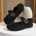 Black canvas fisherman shoes with flat rubber soles shown in adult sizes