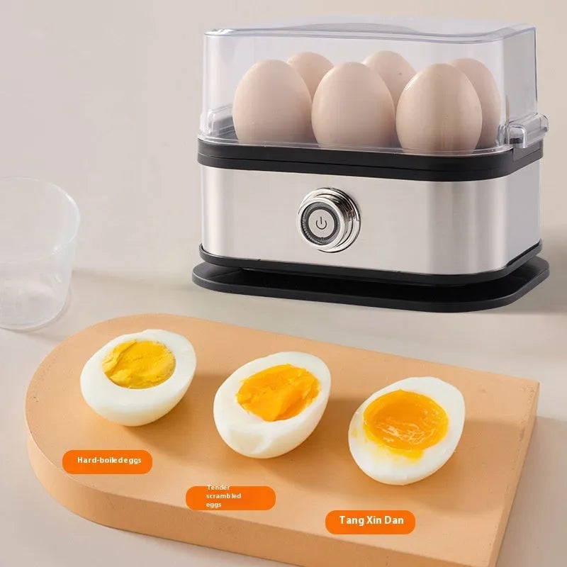 Black stainless steel mini portable electric egg boiler on a countertop