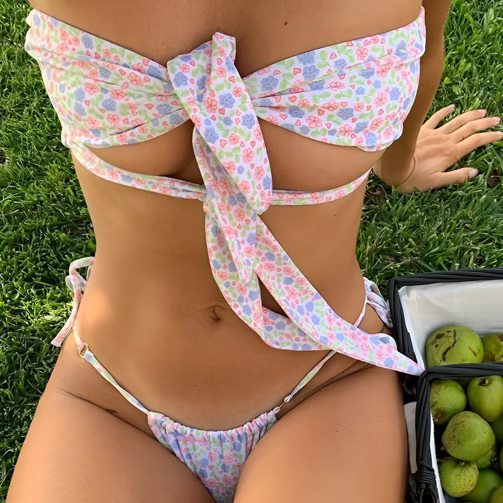Women's sleeveless swimsuit with lace-up front and floral print design