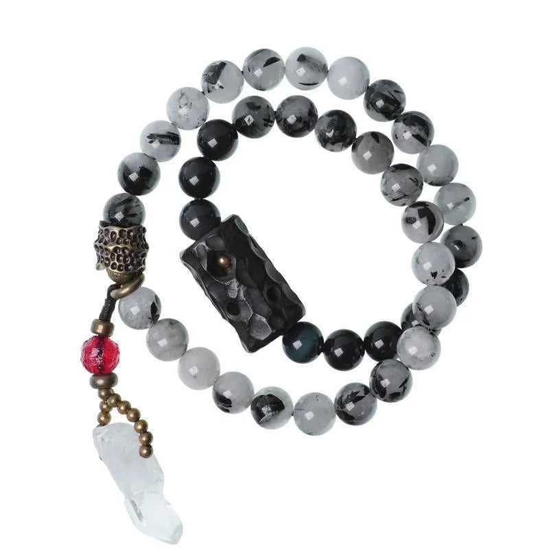 Ethnic style black hair crystal bracelet with white crystal tassel decoration showing bending and lacing construction