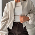 Women's brown loose fit off-shoulder short coat with full lantern sleeves and front pockets