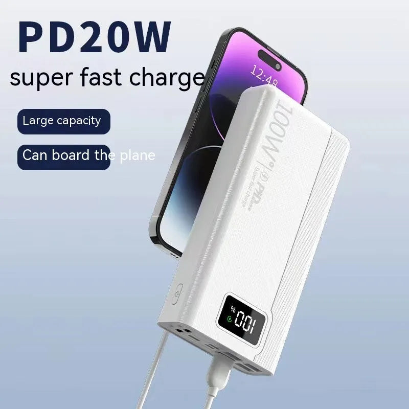 Black and white large capacity portable power bank with fast charging, showing size scale.