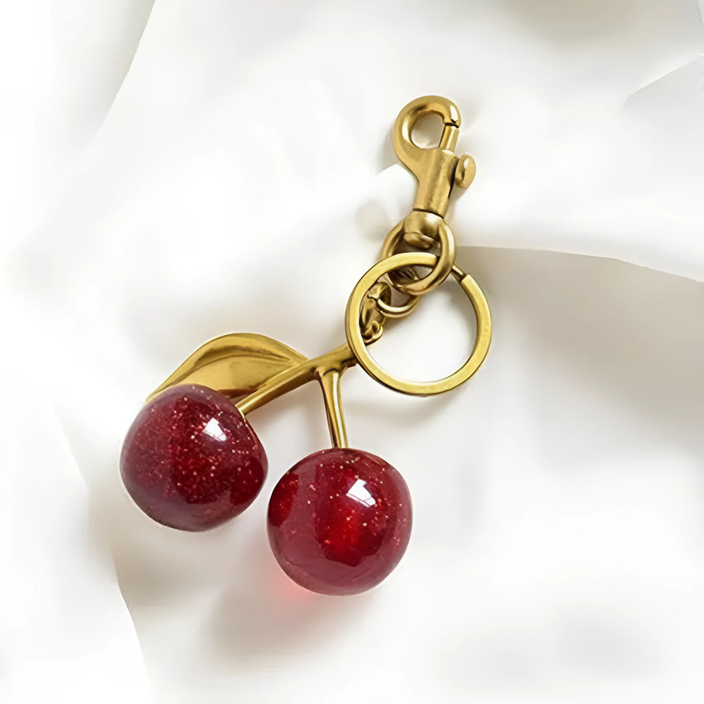 Zinc alloy three-dimensional cherry key pendant in pink or red colour options