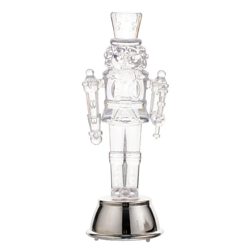 Transparent plastic walnut soldier nutcracker Christmas ornament 9.5cm tall on desktop