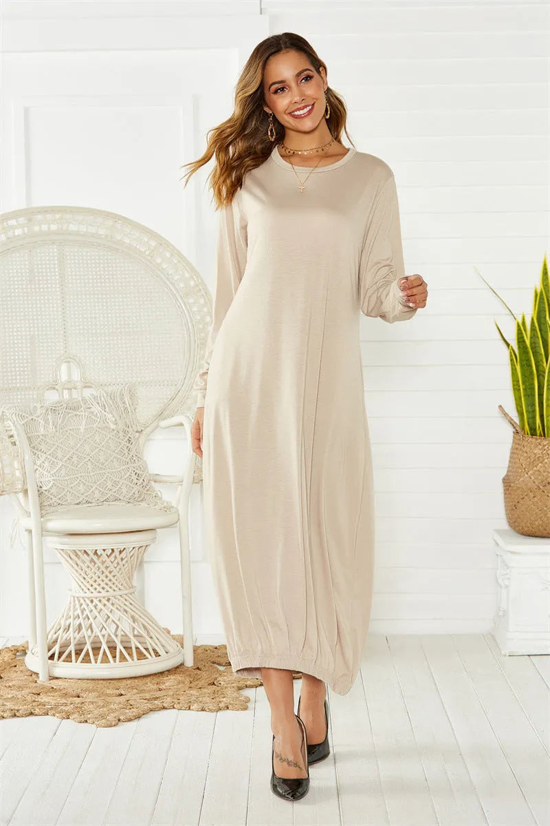 Black loose lantern dress with lace-up crew neck detail, shown on a hanger.