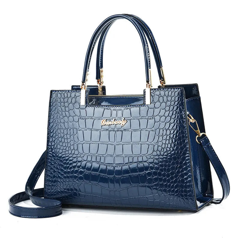 A structured horizontal square one-shoulder handbag in PU leather, shown in a choice of ten colours.