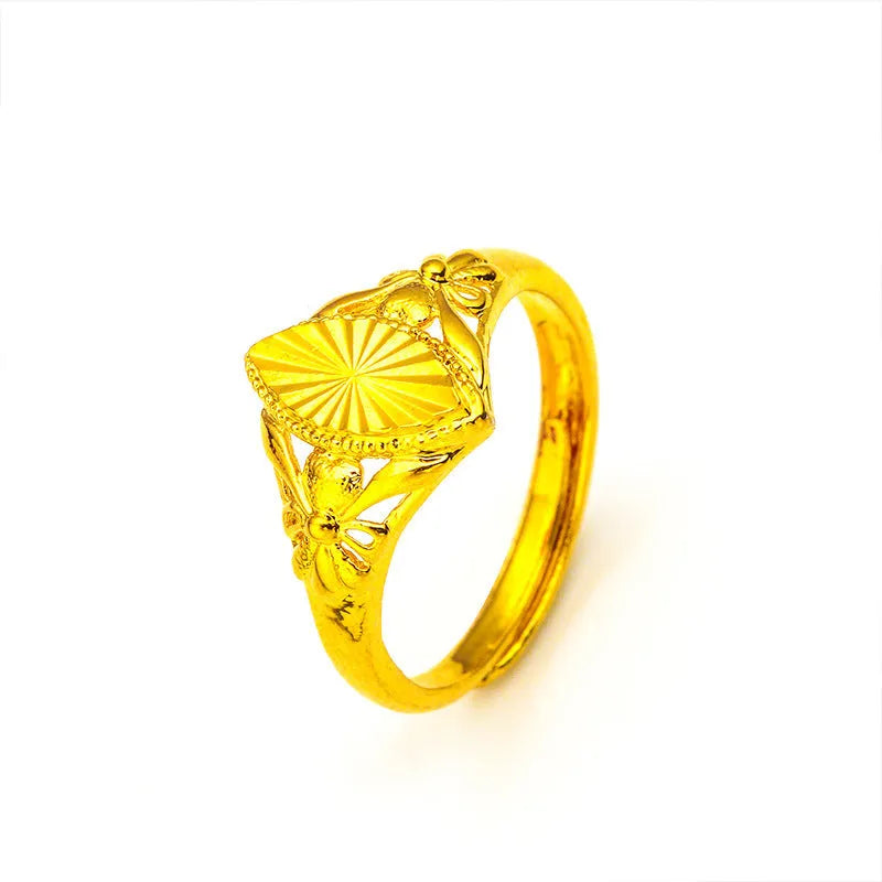 Gold-coloured geometric flower ring with textured surface and open design on brass