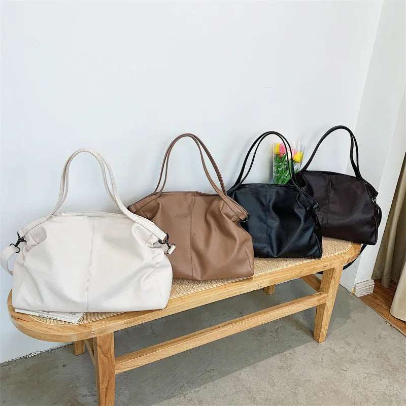 Large soft black PU messenger tote bag with shoulder strap and top zipper